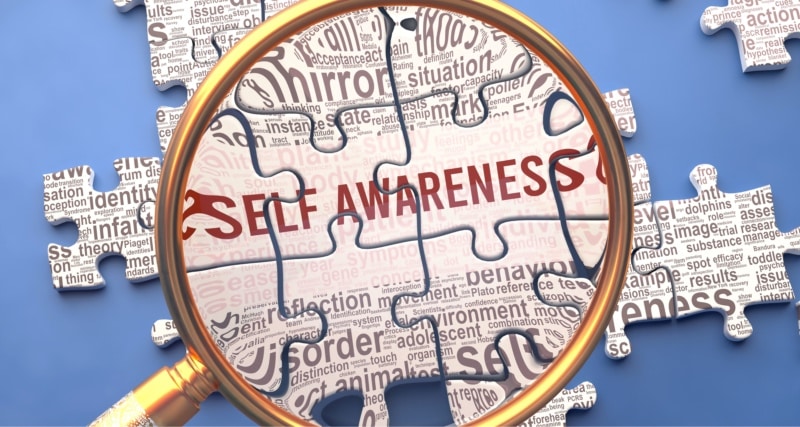 An image of a mirror pointing to a self awareness puzzle