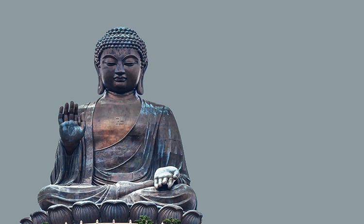 An image of the Buddha with hands in teaching mudra